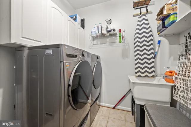 a white toilet sitting next to a bathroom sink