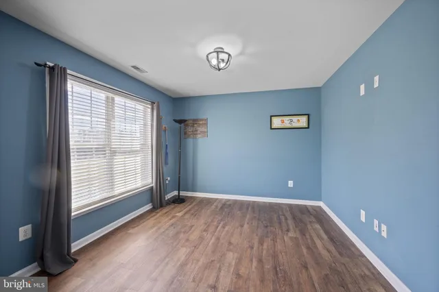 a view of a livingroom with furniture and a flat screen tv