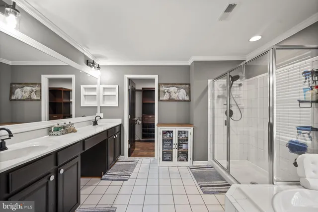 a kitchen with stainless steel appliances a stove sink and wooden floor