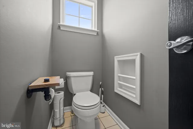 a view of a livingroom with furniture and a flat screen tv