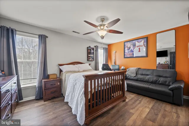a room with pool table and windows