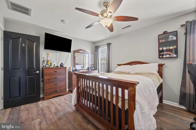 a room with gym equipment and a flat screen tv