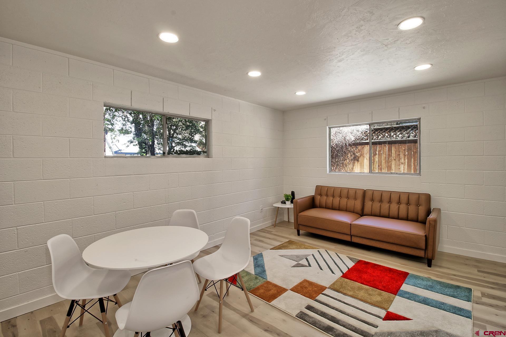 823 Main Street Delta, CO 81416 - Photo 12 of 32 a living room with furniture and a rug