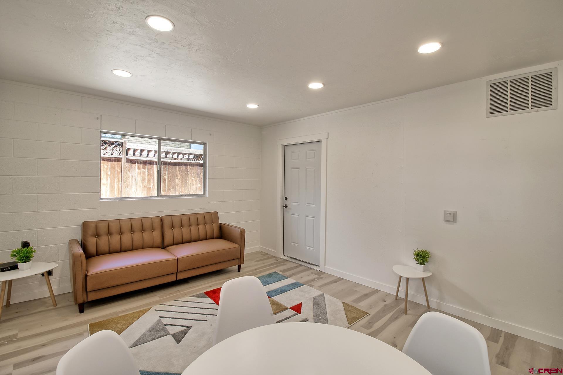 823 Main Street Delta, CO 81416 - Photo 13 of 32 a living room with furniture and a window