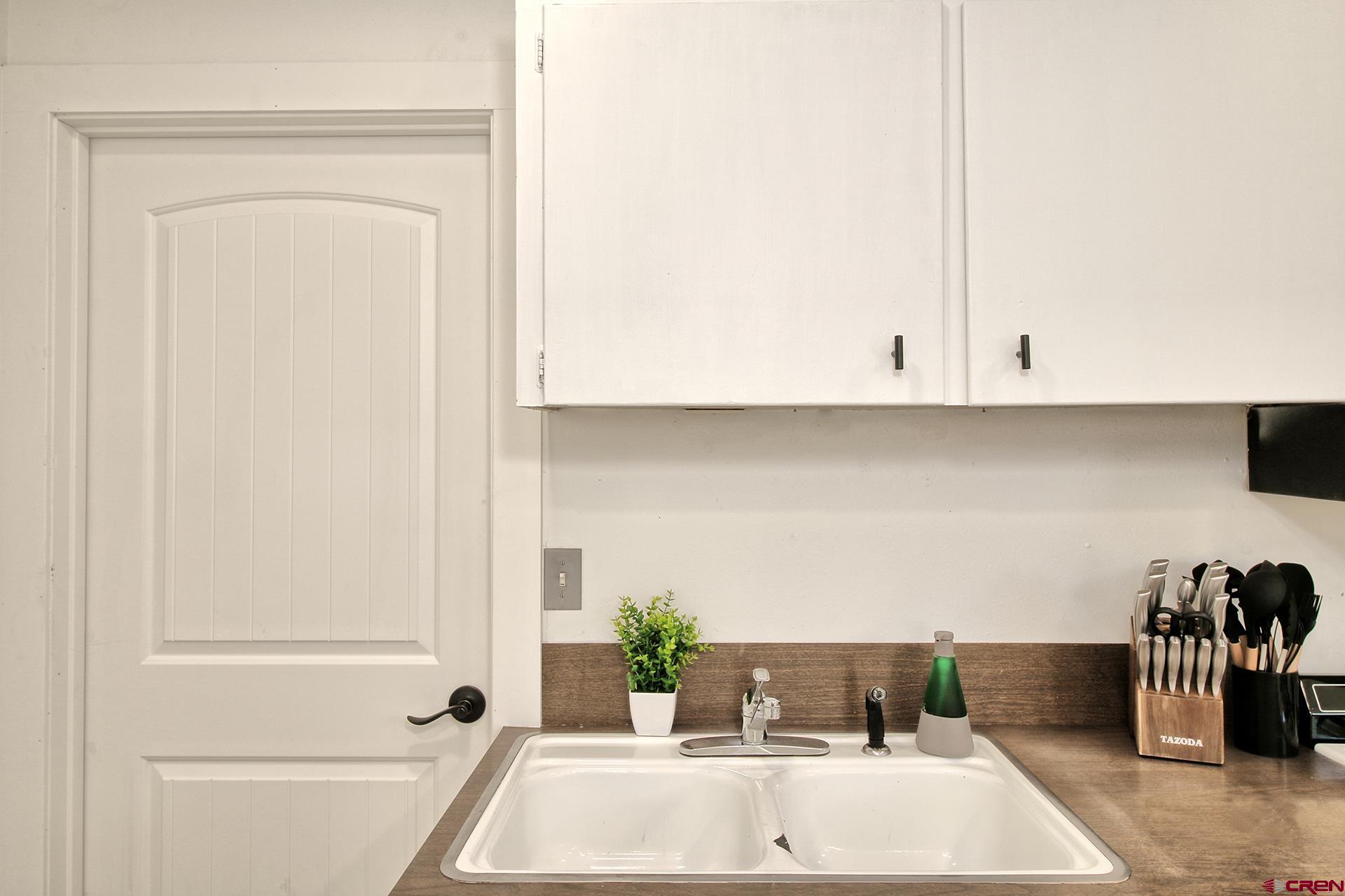 823 Main Street Delta, CO 81416 - Photo 14 of 32 a view of kitchen and utility area