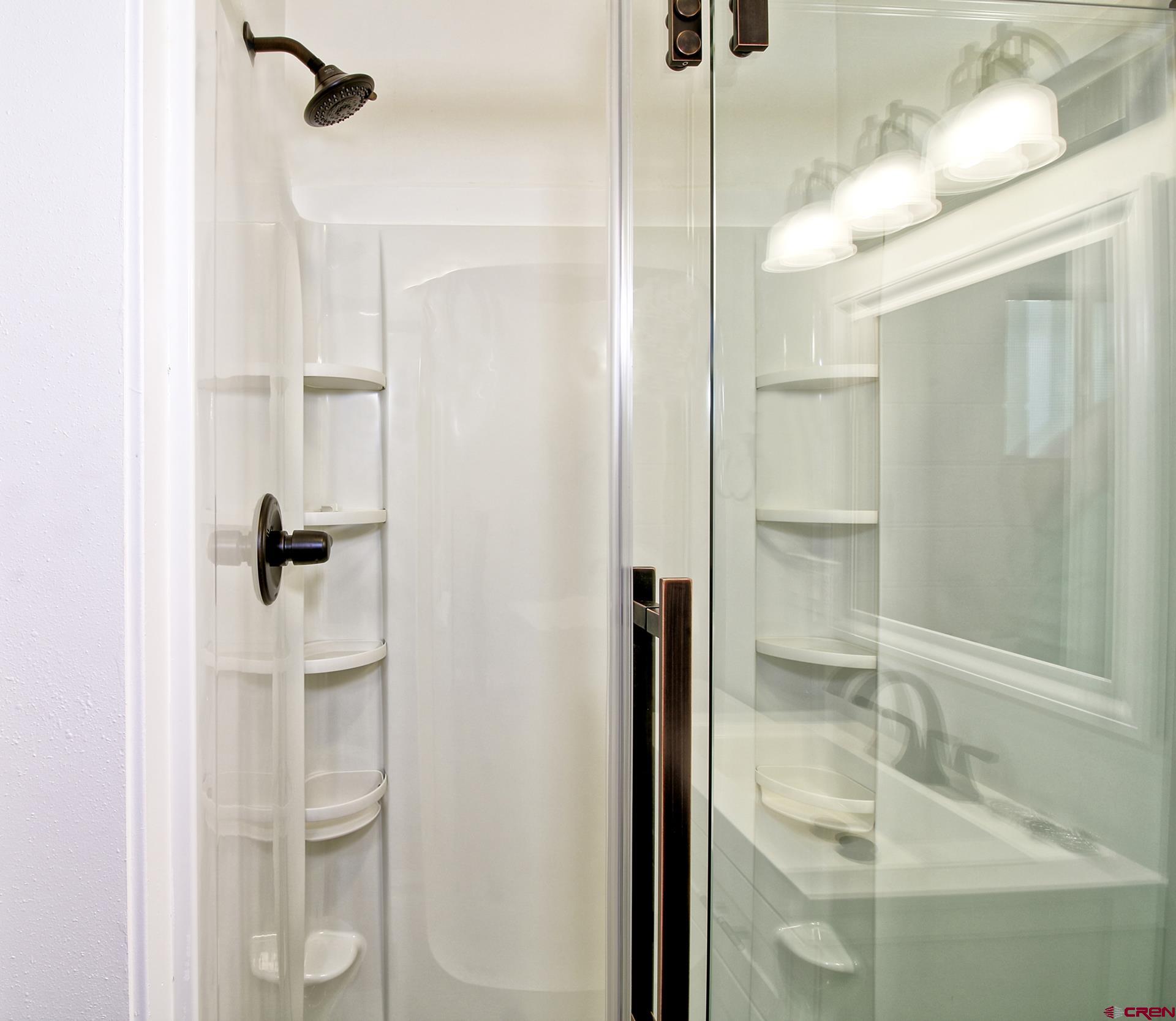 823 Main Street Delta, CO 81416 - Photo 18 of 32 a bathroom with a shower