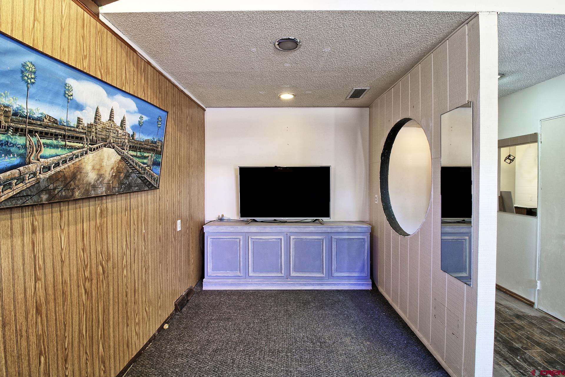 823 Main Street Delta, CO 81416 - Photo 23 of 32 a view of a livingroom with furniture and a flat screen tv