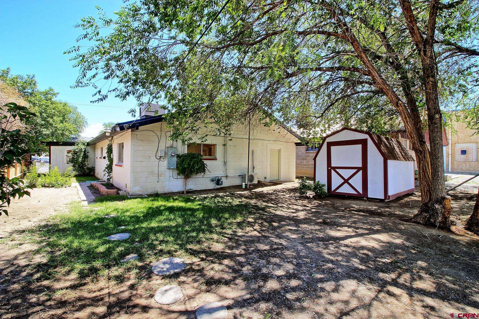 823 Main Street Delta, CO 81416 - Photo 4 of 32 a backyard of a house with seating space