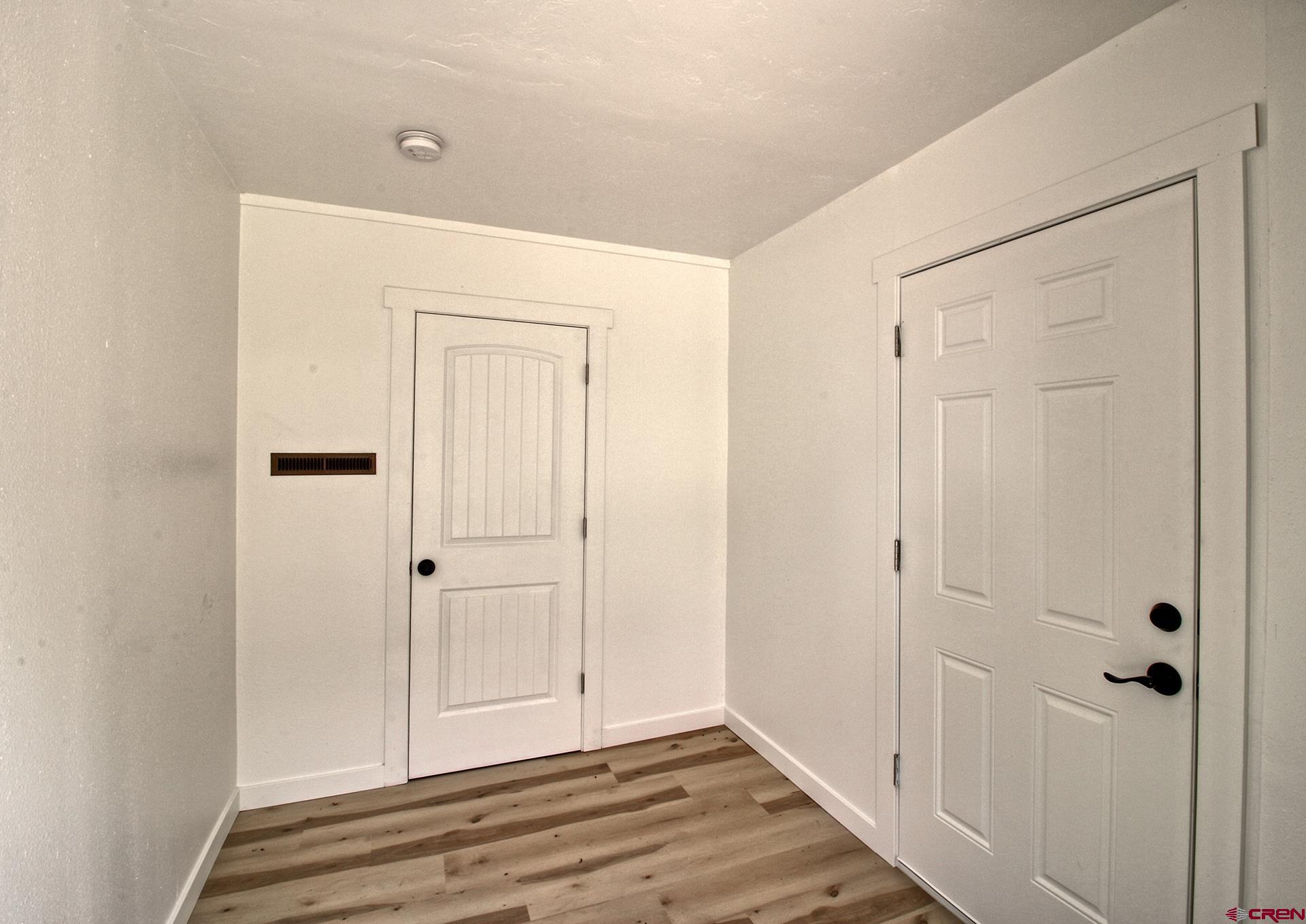 823 Main Street Delta, CO 81416 - Photo 7 of 32 a view of a closet area with wooden floor