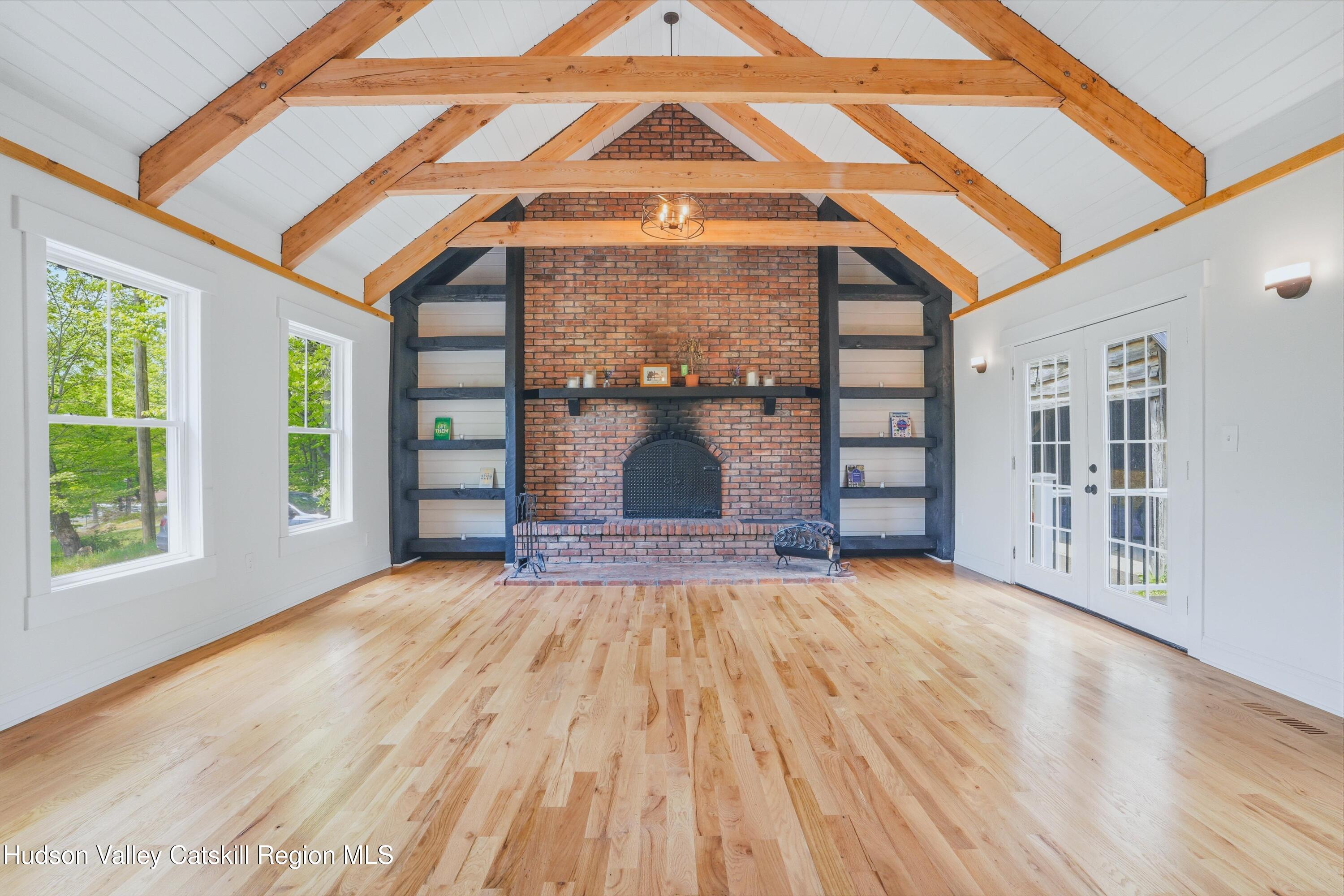 757 Taborton Road Sand Lake, NY 12153 - Photo 11 of 32 a view of empty room with wooden floor and fan