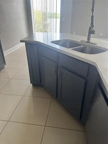 a kitchen with a sink and a window