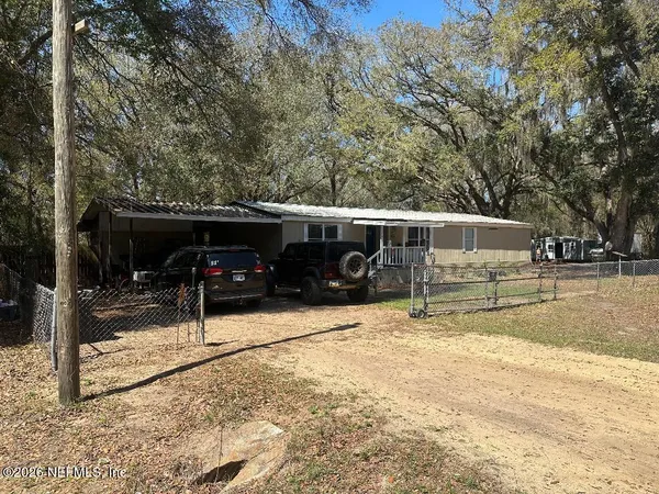 a view of a car park in front of house