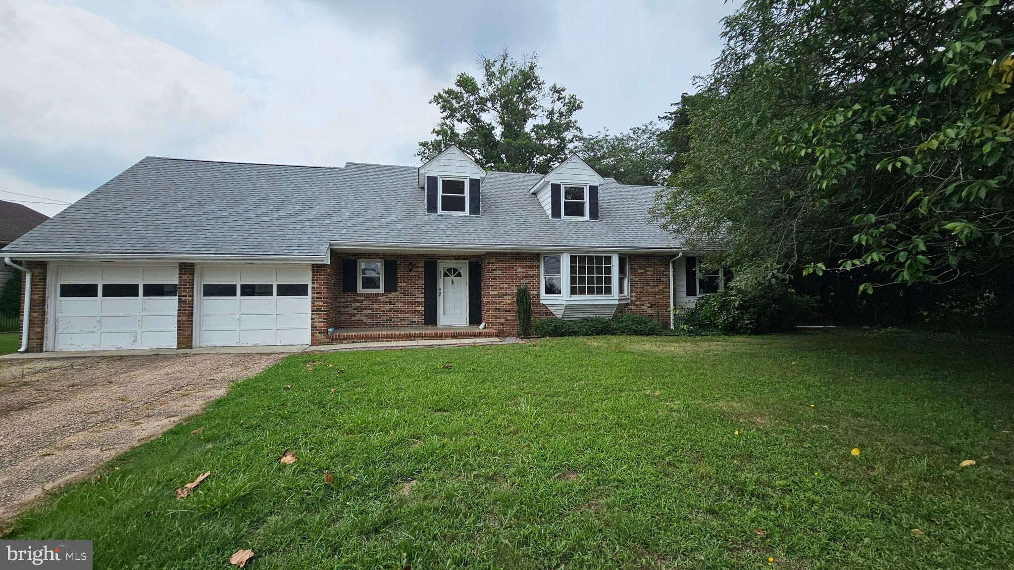 front view of a house with a garden