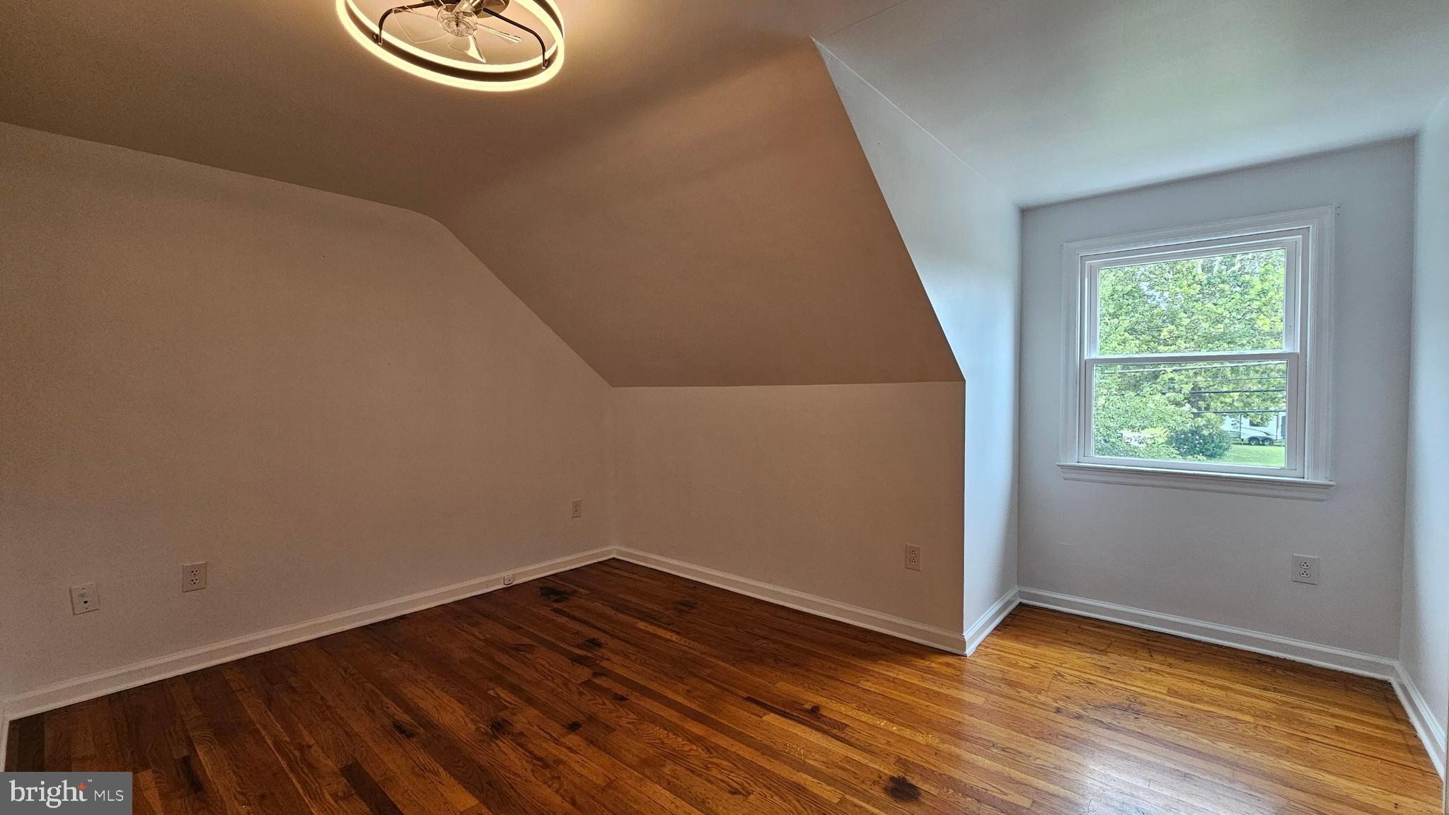 262 Roadstown Road Bridgeton, NJ 08302 - Photo 20 of 25 a view of an empty room with wooden floor and window