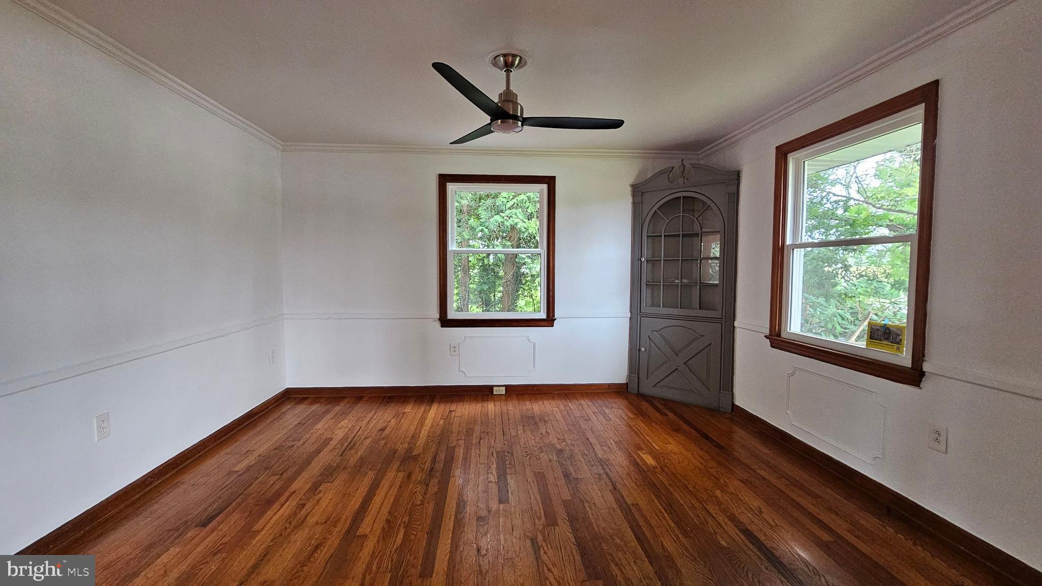 262 Roadstown Road Bridgeton, NJ 08302 - Photo 5 of 25 a view of empty room with wooden floor and fan