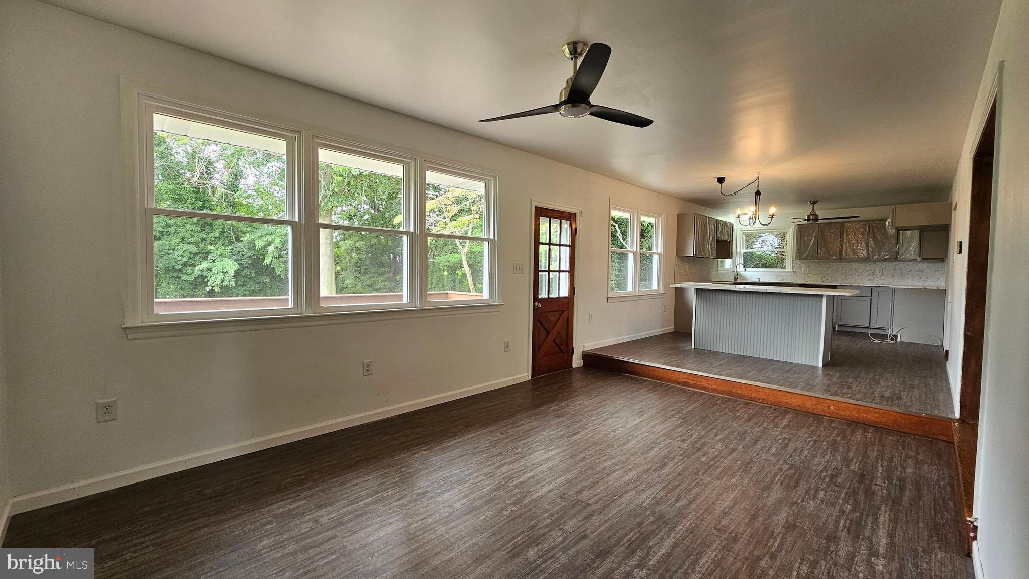 262 Roadstown Road Bridgeton, NJ 08302 - Photo 9 of 25 a view of a kitchen with a sink wooden floor and a window