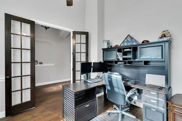 a kitchen with granite countertop a stove a sink and a microwave