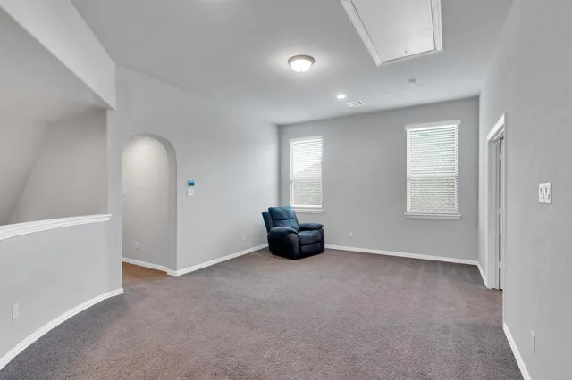 a view of an empty room and window