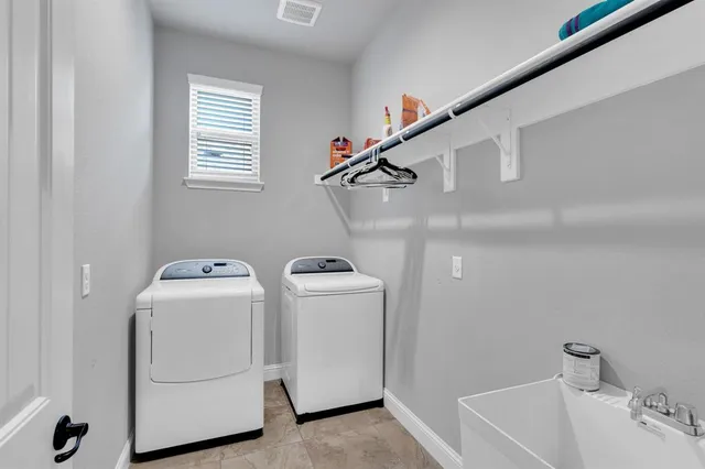 a utility room with dryer and washer