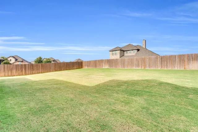 a view of a large building with a big yard