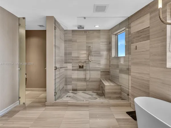 a bedroom with a bed and lamp