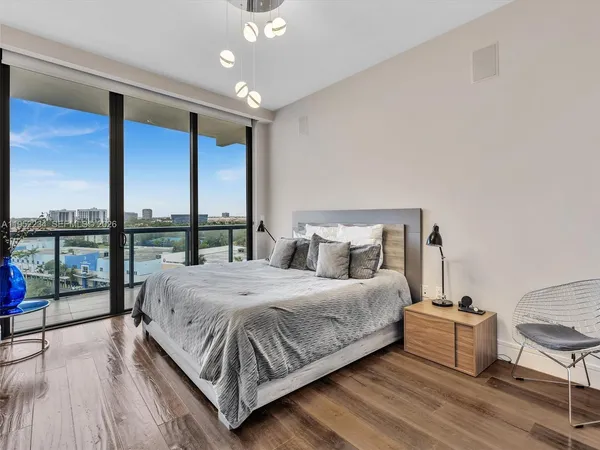 a bathroom with a toilet a sink and shower