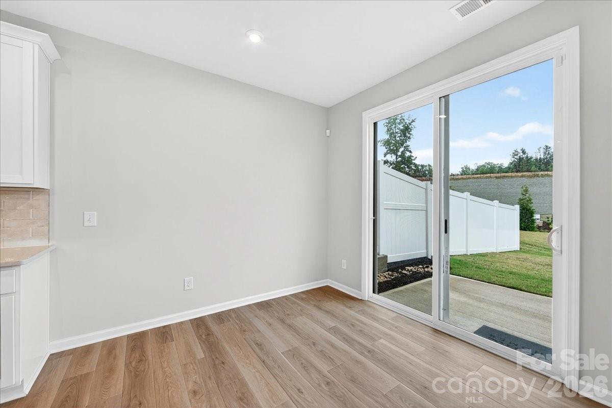 512 Webster Lane Cramerton, NC 28032 - Photo 10 of 28 a view of wooden floor and windows in a room