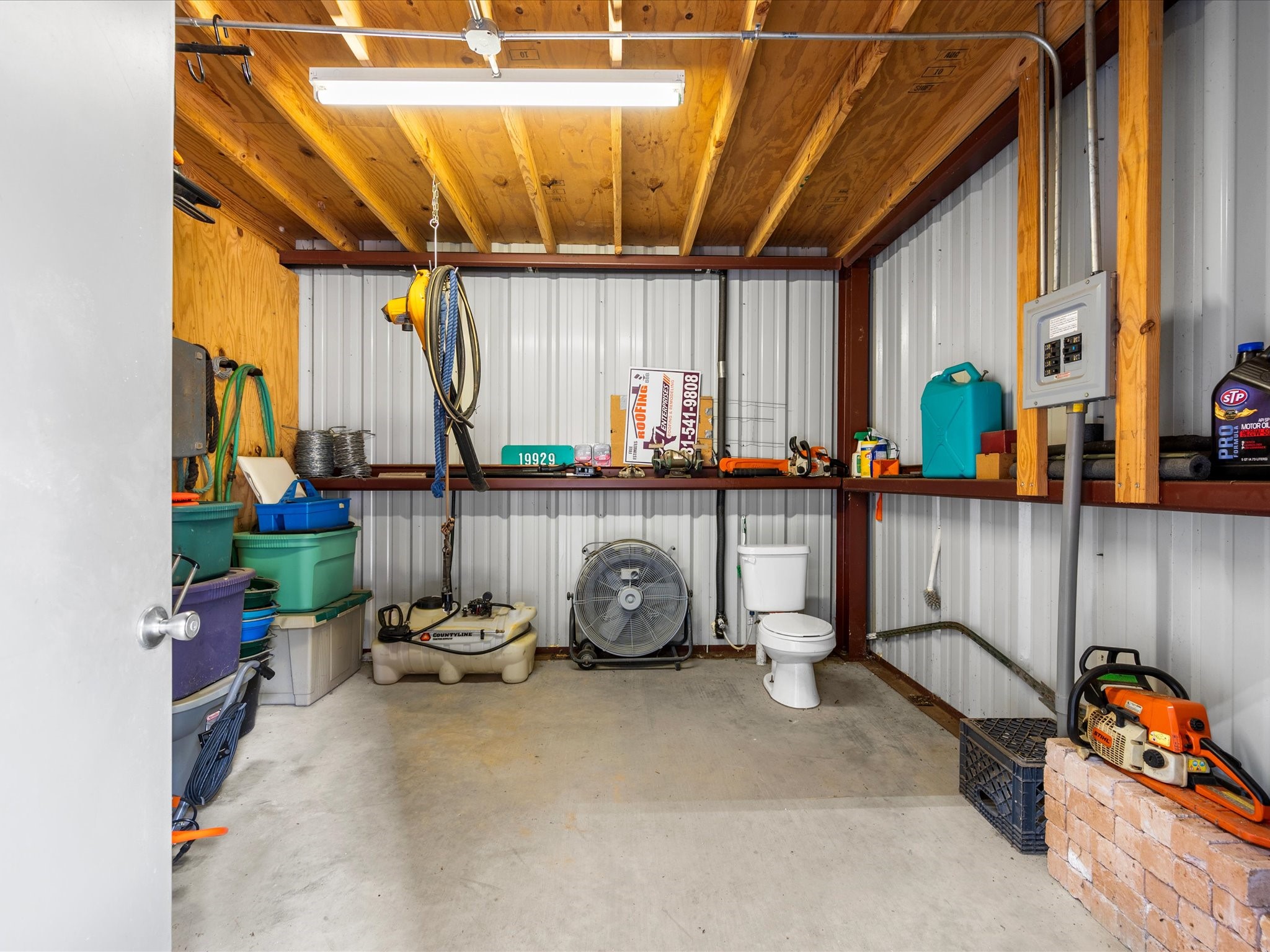19929 Pierceall Road Hempstead, TX 77445 - Photo 35 of 50 A dedicated storage room within the barn offers valuable space for keeping equipment, supplies, and belongings organized.