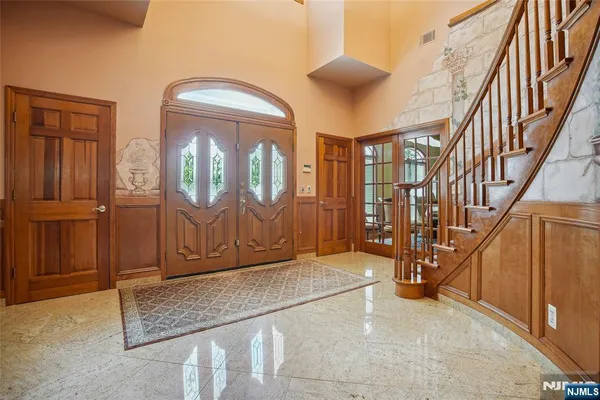 a dining room with chairs window and wooden floor