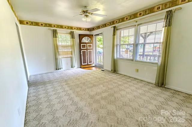 a view of an empty room with a window