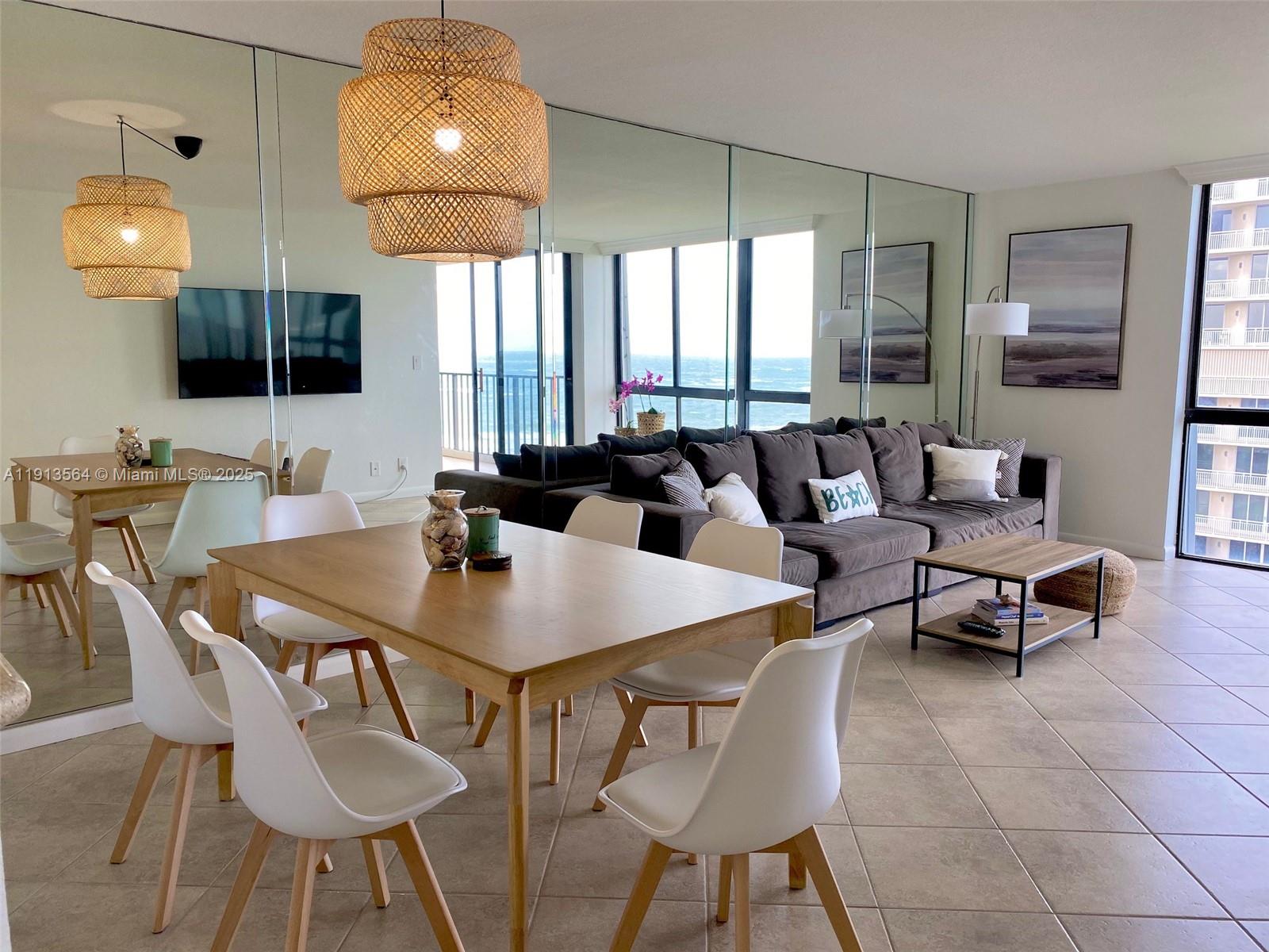 2800 North Hwy A1A, Unit 803 Fort Pierce, FL 34949 - Photo 12 of 35 a view of a dining room with furniture and wooden floor