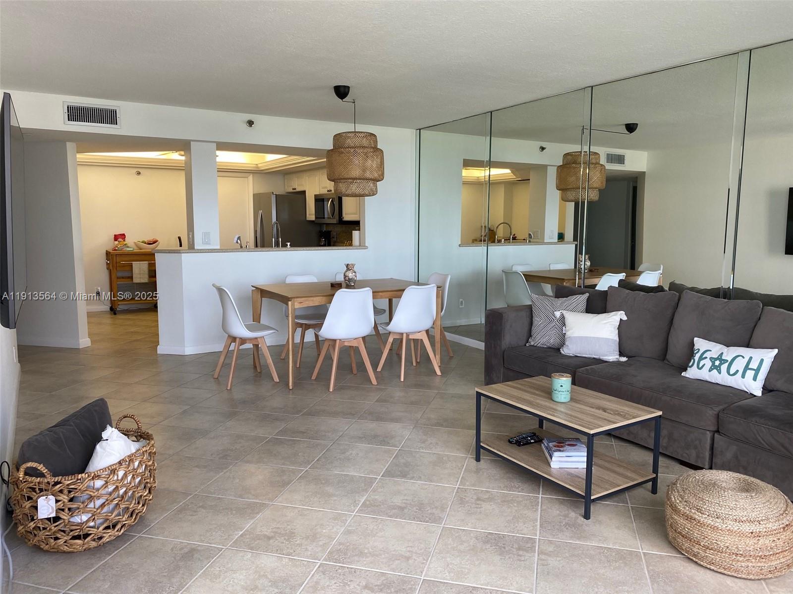 2800 North Hwy A1A, Unit 803 Fort Pierce, FL 34949 - Photo 16 of 35 a living room with furniture and a large window