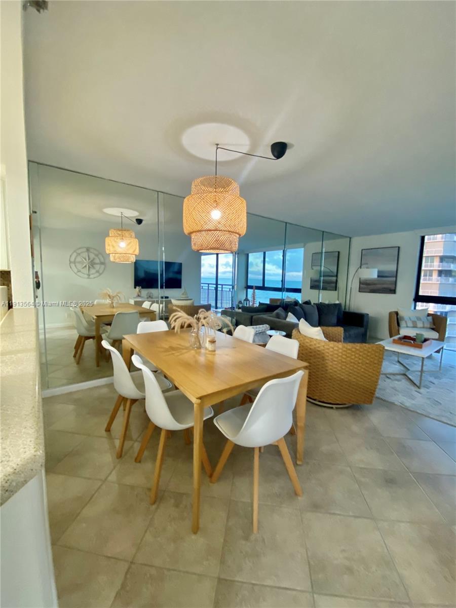 2800 North Hwy A1A, Unit 803 Fort Pierce, FL 34949 - Photo 18 of 35 a dining room with a table and chairs