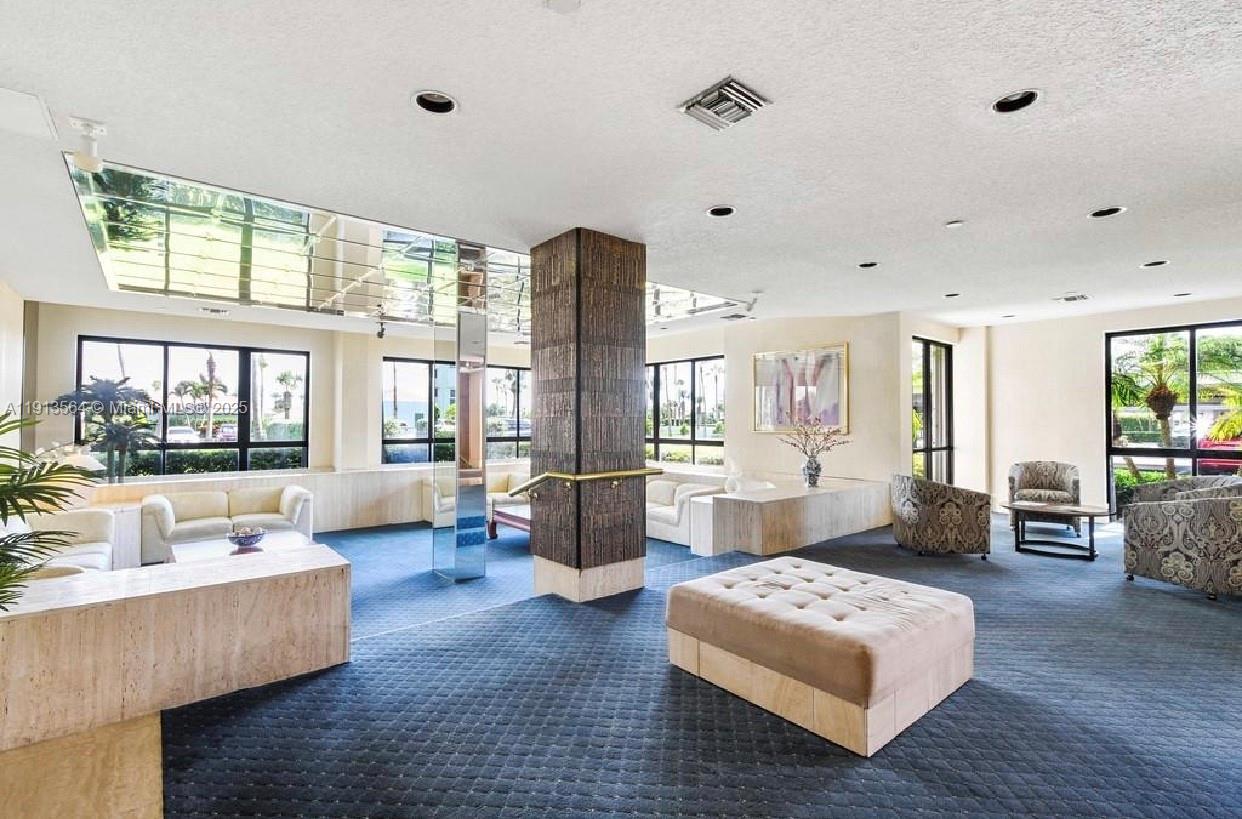2800 North Hwy A1A, Unit 803 Fort Pierce, FL 34949 - Photo 33 of 35 a living room with furniture and large windows