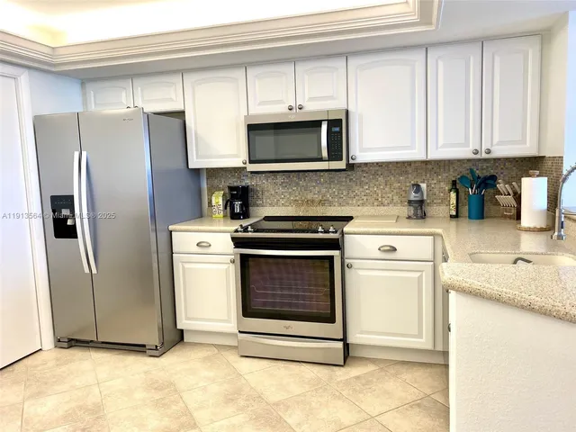 a bedroom with a bed and flat screen tv