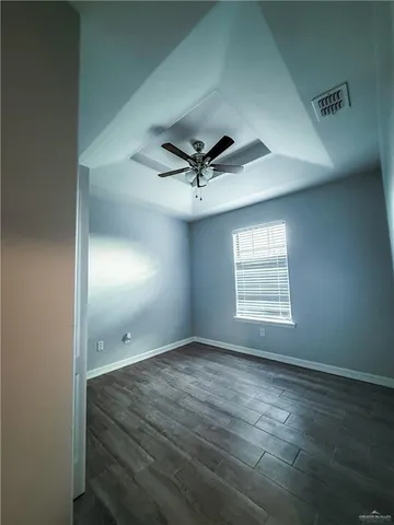 a view of room with window and ceiling fan