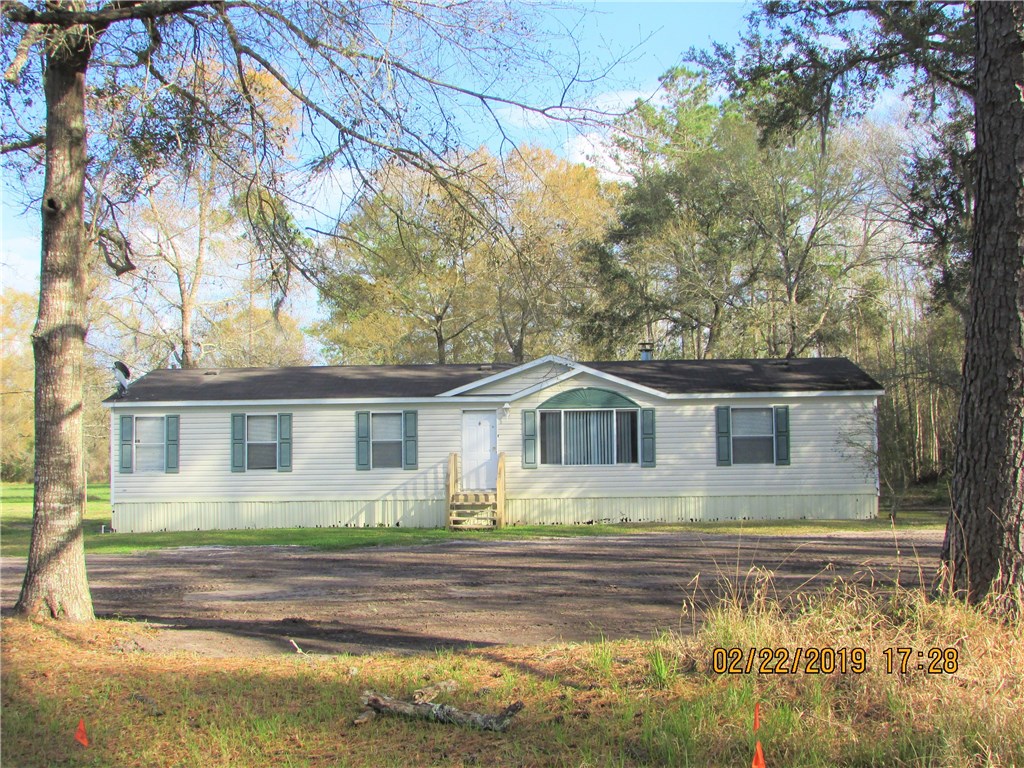 371673 Kings Ferry Road Hilliard, FL 32046 - Photo 1 of 34 front view of house with a yard