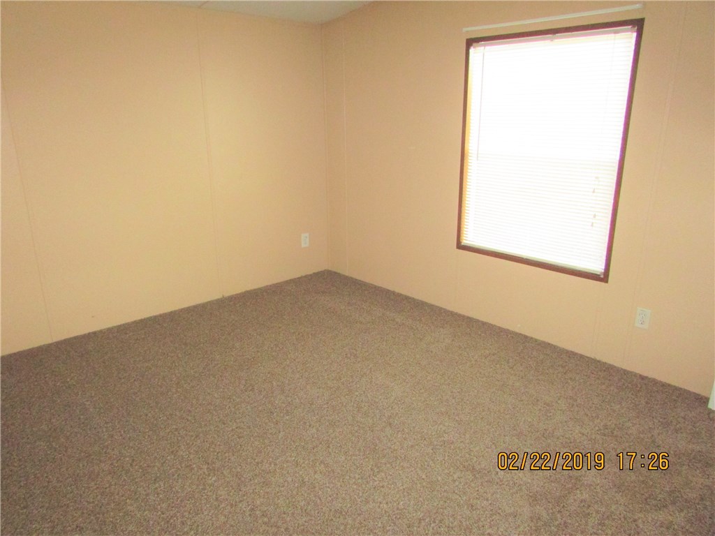 371673 Kings Ferry Road Hilliard, FL 32046 - Photo 15 of 34 an empty room with a window