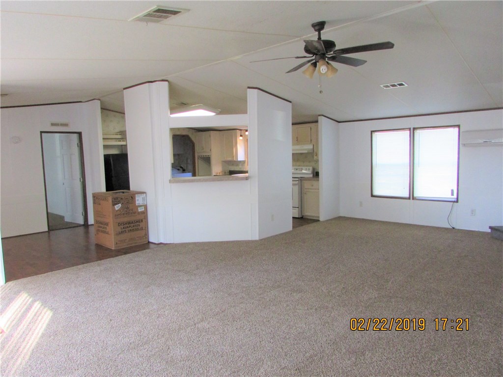 371673 Kings Ferry Road Hilliard, FL 32046 - Photo 3 of 34 a living room with furniture and a flat screen tv