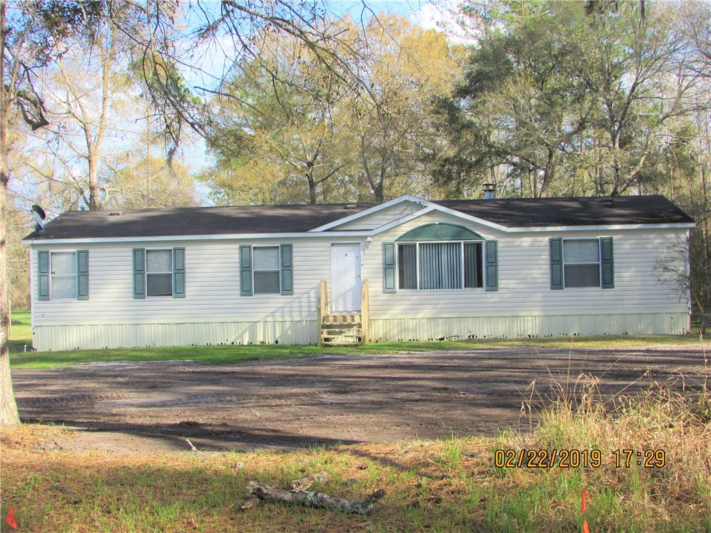 371673 Kings Ferry Road Hilliard, FL 32046 - Photo 34 of 34 a front view of a house with a yard