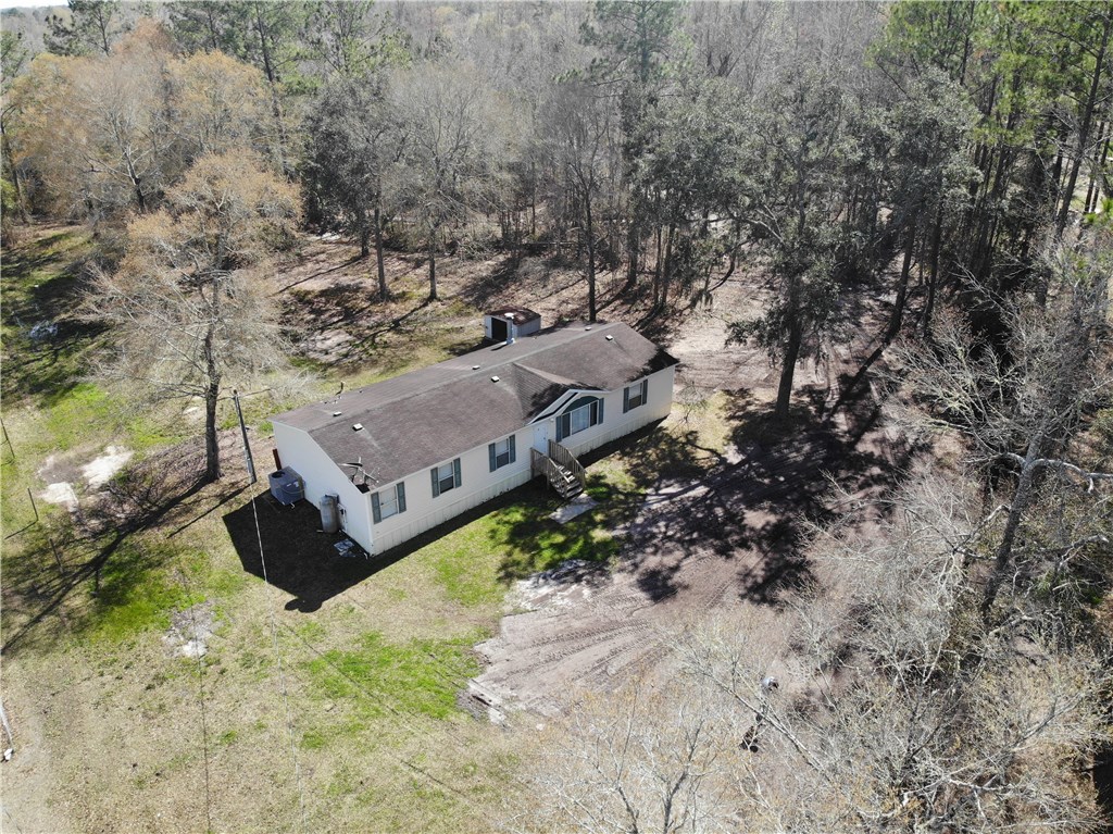 371673 Kings Ferry Road Hilliard, FL 32046 - Photo 5 of 34 an aerial view of a house with a yard and large tree
