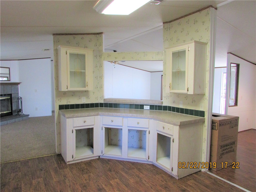 371673 Kings Ferry Road Hilliard, FL 32046 - Photo 10 of 34 a kitchen with granite countertop a stove and a sink