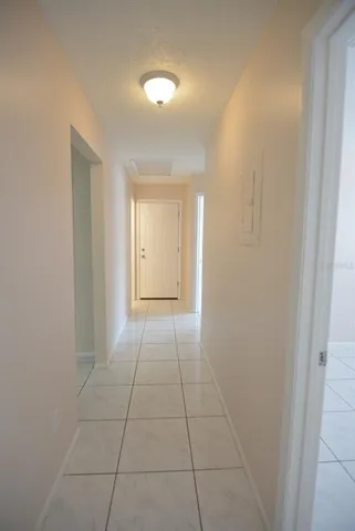 a view of a livingroom with an empty space and a window