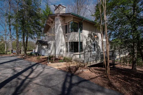 a view of a house with brick walls