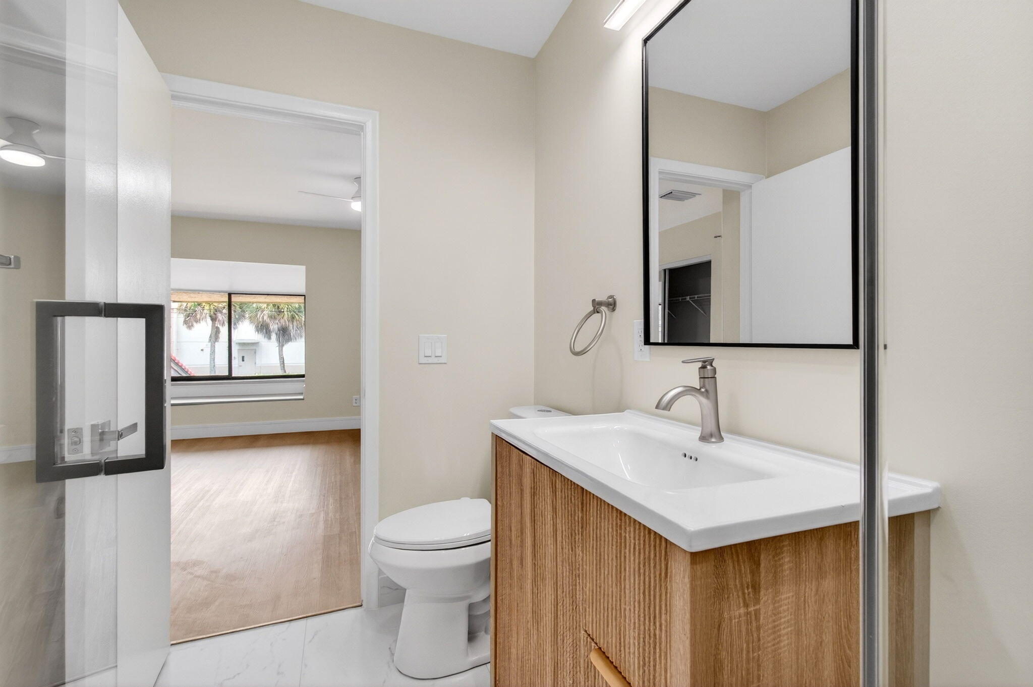 1330 Northwest 13th Street, Unit 12 Boca Raton, FL 33486 - Photo 41 of 52 a bathroom with a sink and a mirror