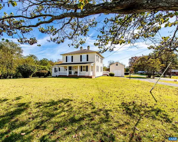 a large building with trees in the background