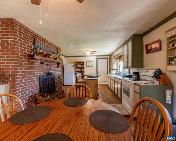a dining room with furniture and wooden floor
