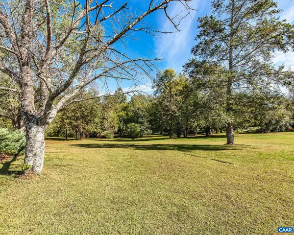 a view of a house with a big yard