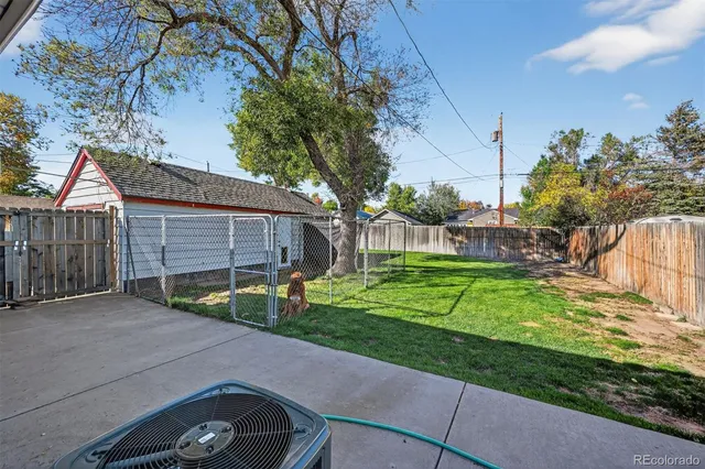 a view of backyard with a garden and entertaining space