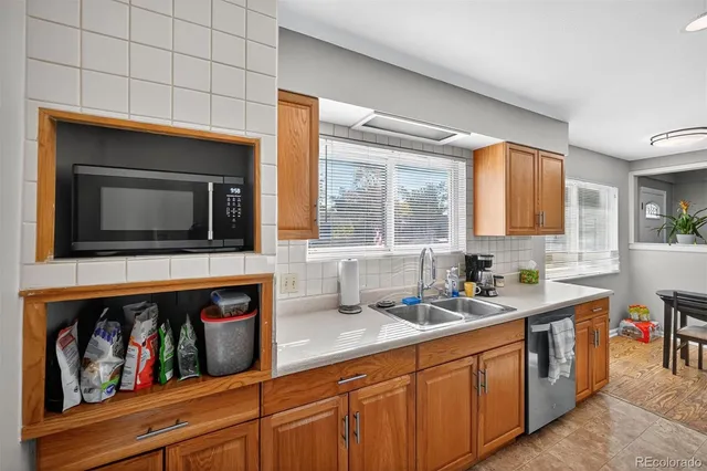 a kitchen with a sink and cabinets